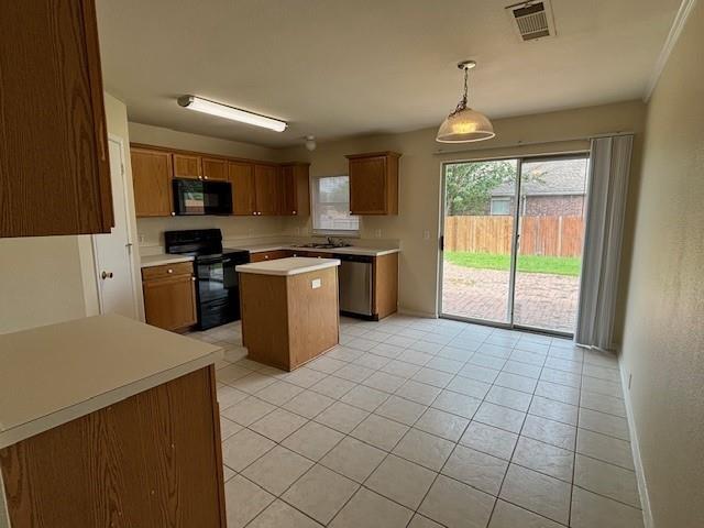2316 Penton Way Little Elm, TX 75068 - Photo 8 of 22 a kitchen with stainless steel appliances granite countertop a stove top oven a sink a counter top space and cabinets