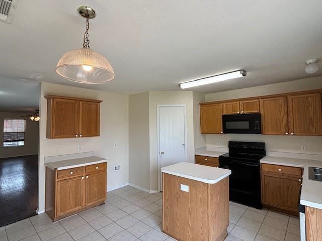 2316 Penton Way Little Elm, TX 75068 - Photo 9 of 22 a kitchen with a stove and a refrigerator