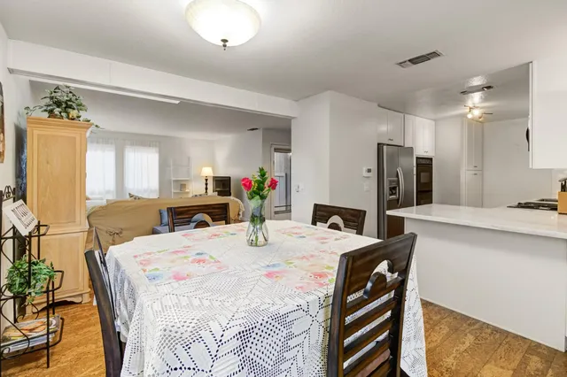 a kitchen with kitchen island a sink stainless steel appliances and cabinets