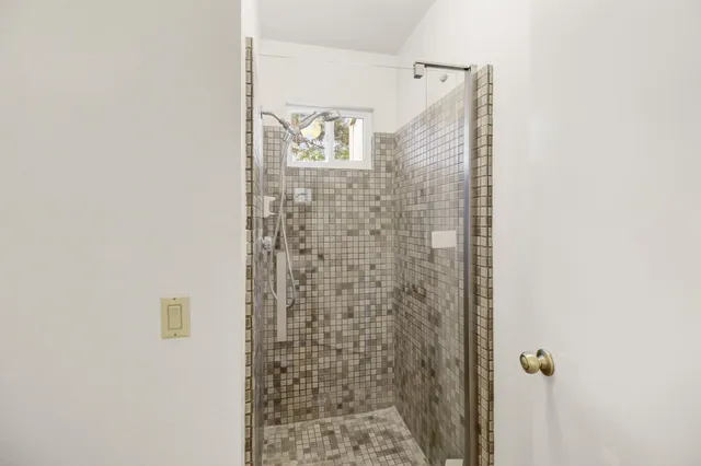 a view of a chairs and table in the backyard