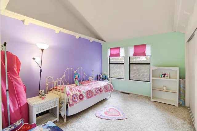 a view of a backyard with plants and a patio