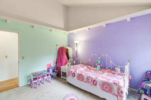 a view of a backyard with chair and table