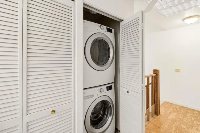 a front view of a house with a chairs in patio