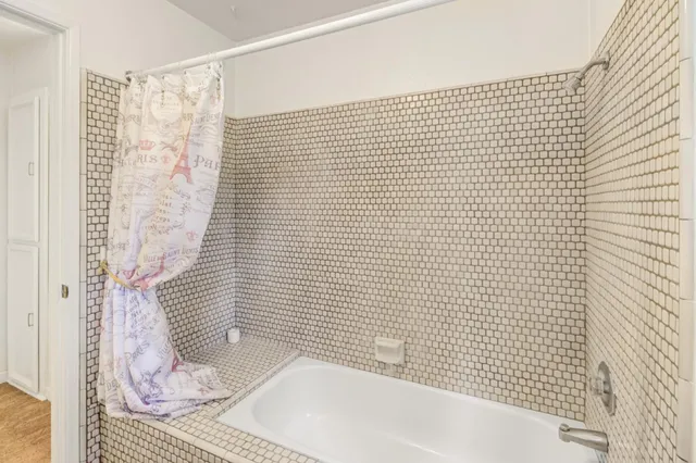 front view of a house with a tree