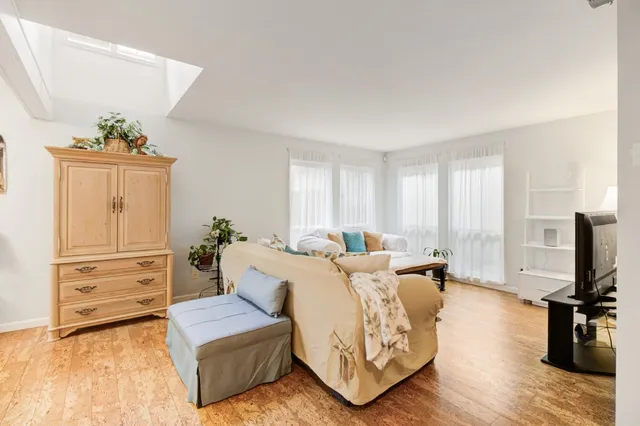 a spacious bedroom with a bed and a couch