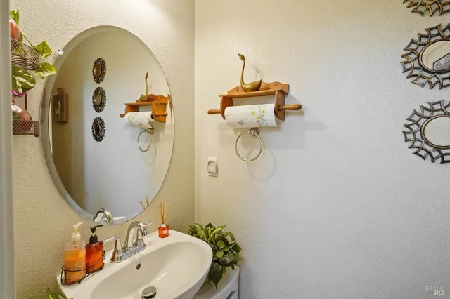 a bathroom with a sink and mirror