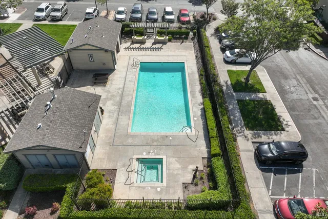 an aerial view of a house with a garden and trees