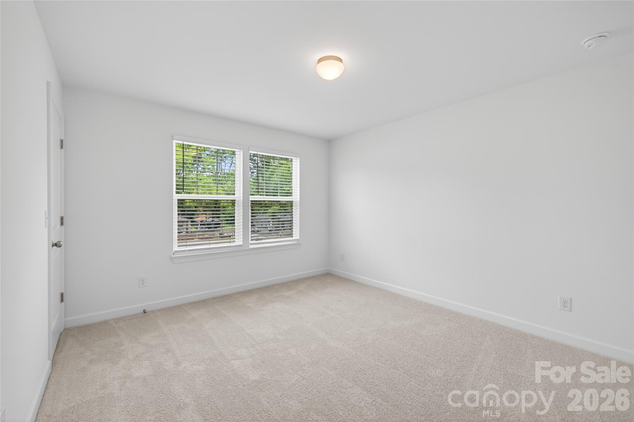 128 Overcash Road, Unit 7171 Troutman, NC 28166 - Photo 27 of 41 an empty room with a window