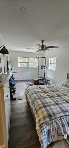 a bed room with a bed and a large window