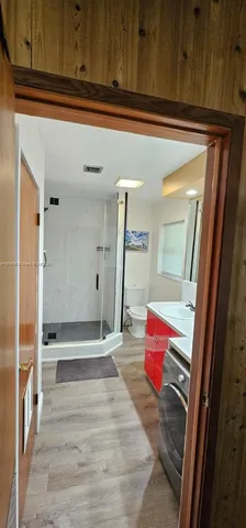 a view of an entryway with wooden floor