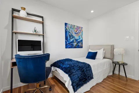 a view of a balcony with wooden floor