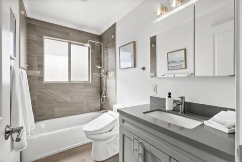 a view of a patio with table and chairs