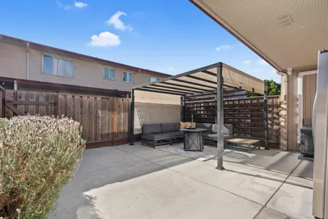 a backyard of a house with seating space