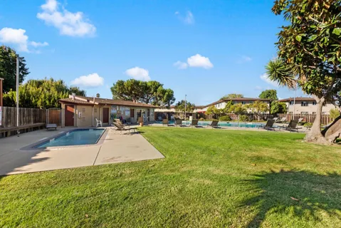 an aerial view of a houses with a lake view