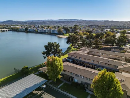 an aerial view of a residential houses with outdoor space