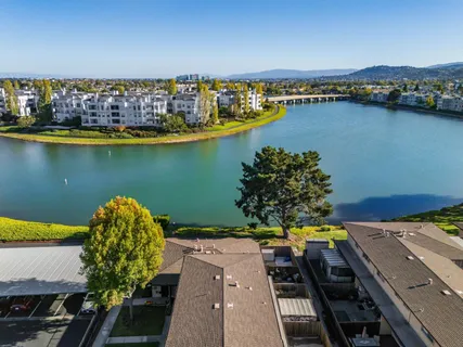 an aerial view of a houses with ocean view