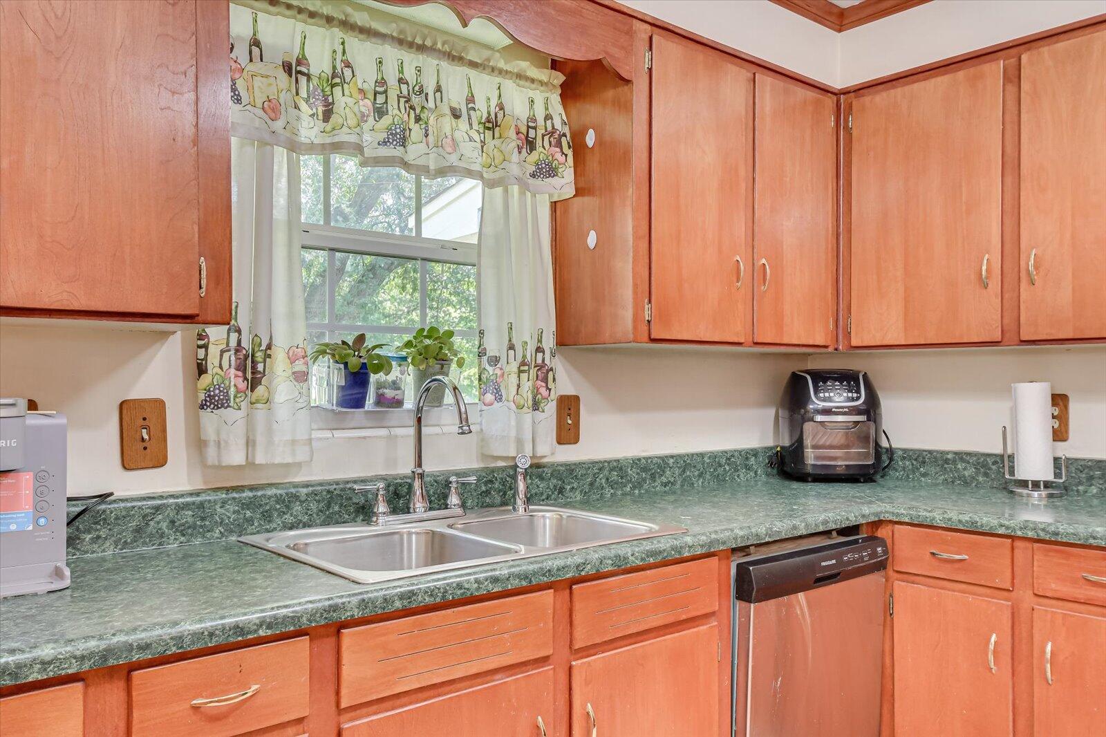 308 5th Street Jackson, SC 29831 - Photo 19 of 70 a kitchen with granite countertop a sink a counter top space cabinets and stainless steel appliances