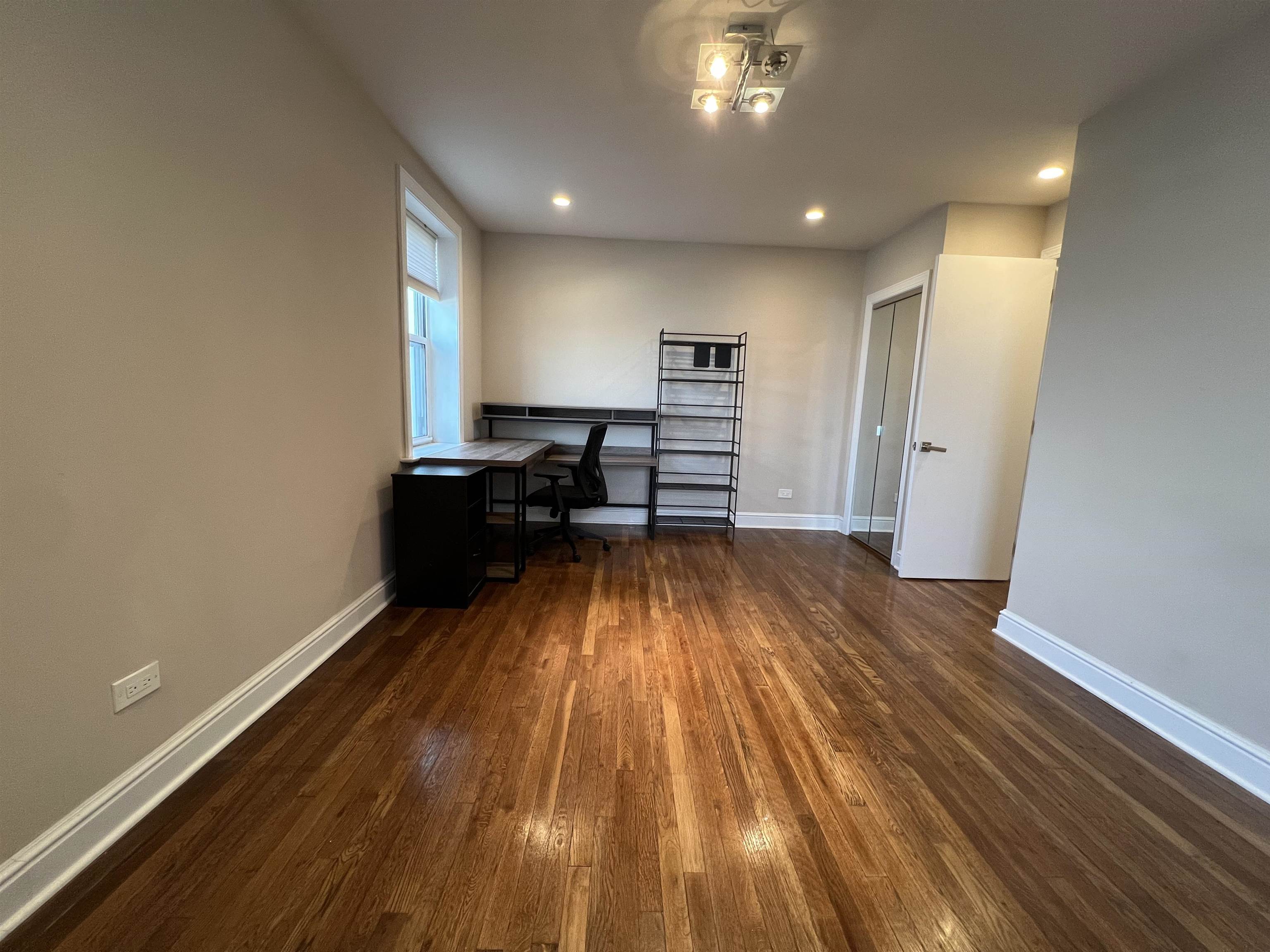 8550 Boulevard East, Unit 3C North Bergen, NJ 07047 - Photo 14 of 25 a view of a room with wooden floor and a window