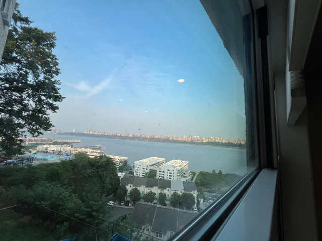an aerial view of residential houses with outdoor space and swimming pool