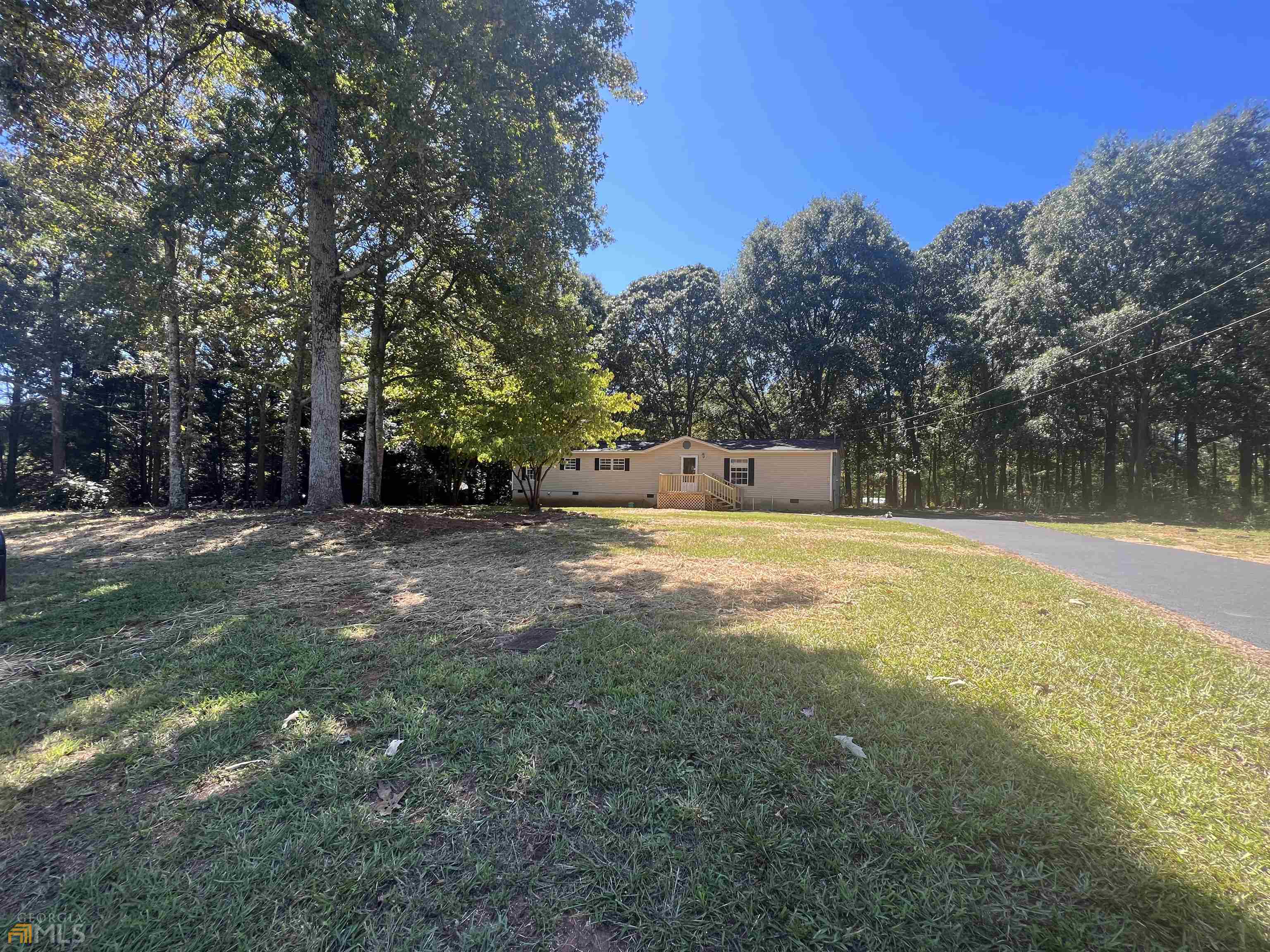 160 Hunter's Ridge Lane Nicholson, GA 30565 - Photo 1 of 1 a view of outdoor space with swimming pool and green space