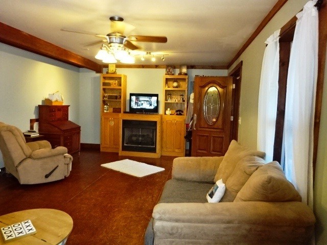 610 Samples Chapel Road Southeast Cleveland, TN 37323 - Photo 4 of 47 a living room with furniture and a fireplace