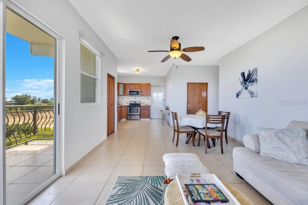 413 Camino Carretas, Unit A7 Rincon, Rincón 00677 - Photo 9 of 23 a living room with furniture and a table