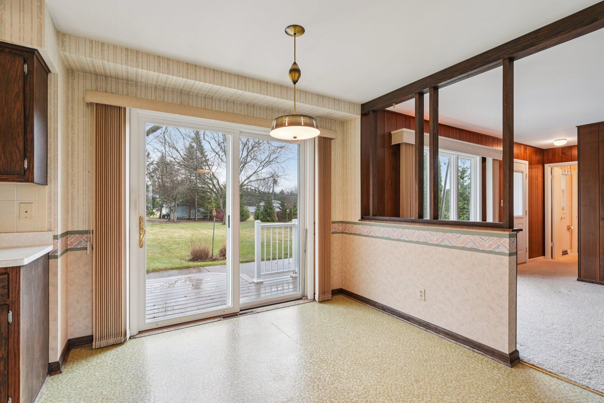 558 Horns Corners Road Cedarburg, WI 53012 - Photo 8 of 23 Patio door to deck-patio & big backyard. Open to Family Room