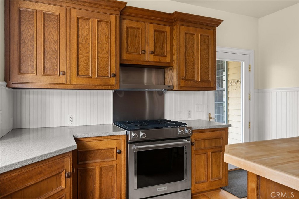 3576 Dry Creek Road Oroville, CA 95965 - Photo 24 of 75 a kitchen with wooden cabinets and a stove top oven