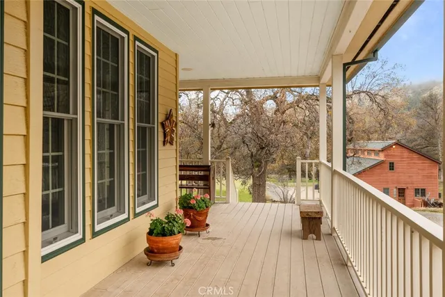 a view of entryway with wooden floor and stairs