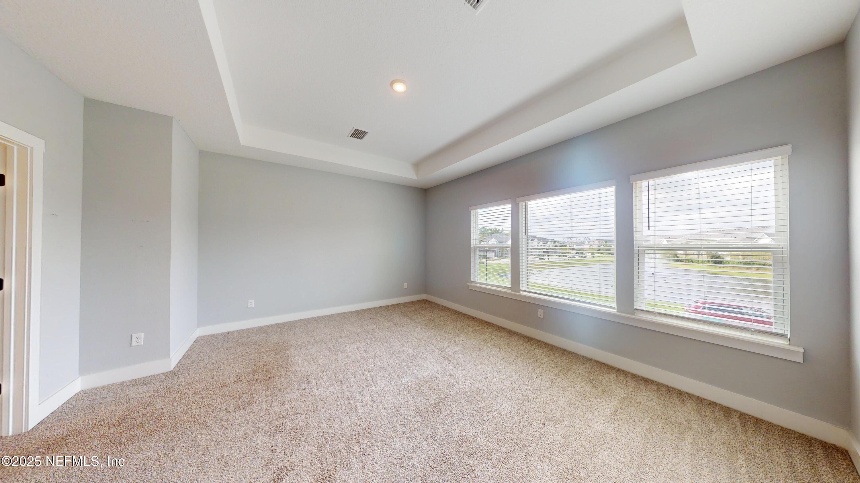 9921 Element Road Jacksonville, FL 32256 - Photo 22 of 37 a view of an empty room with a window