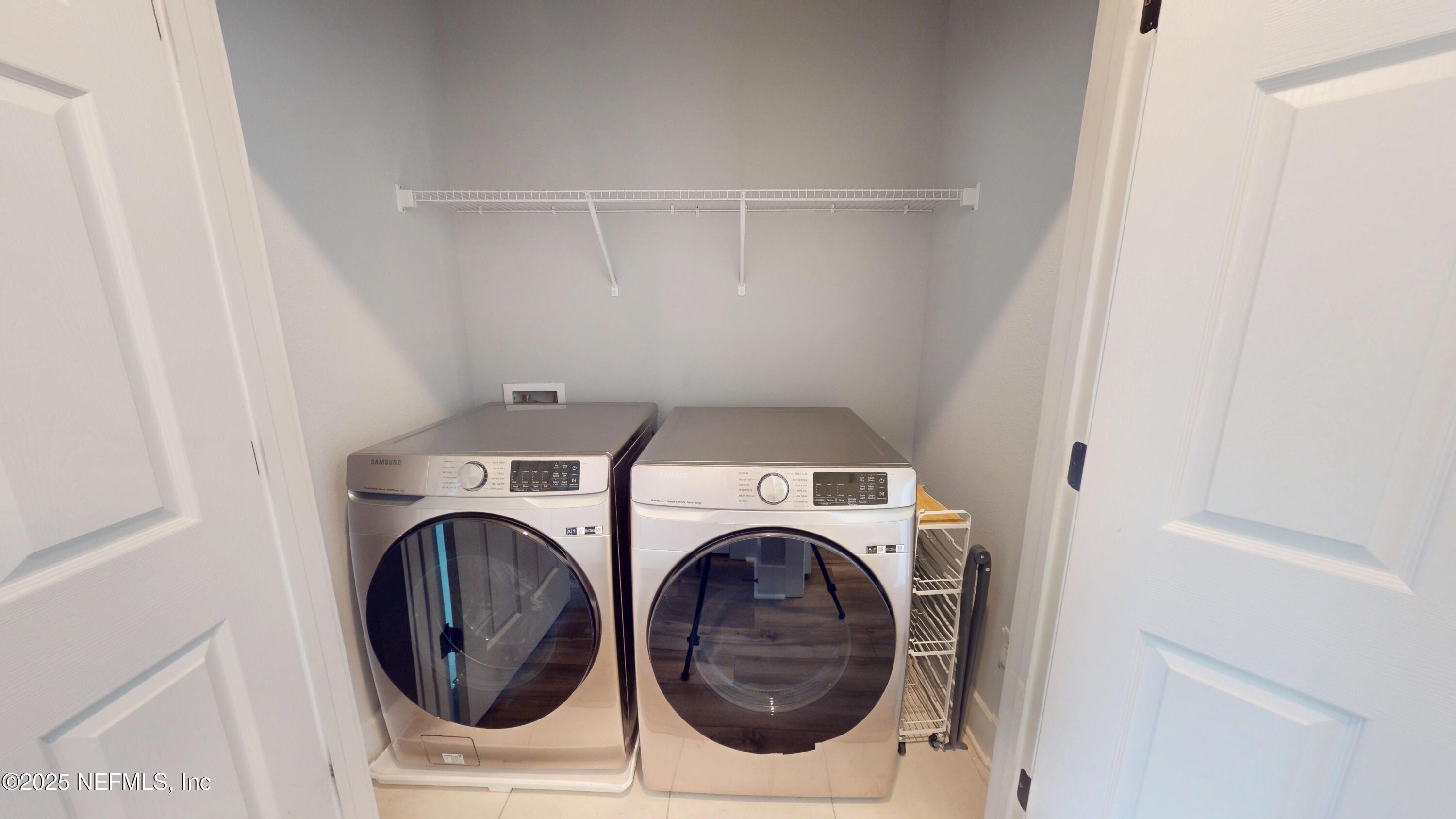 9921 Element Road Jacksonville, FL 32256 - Photo 27 of 37 a utility room with dryer and washer