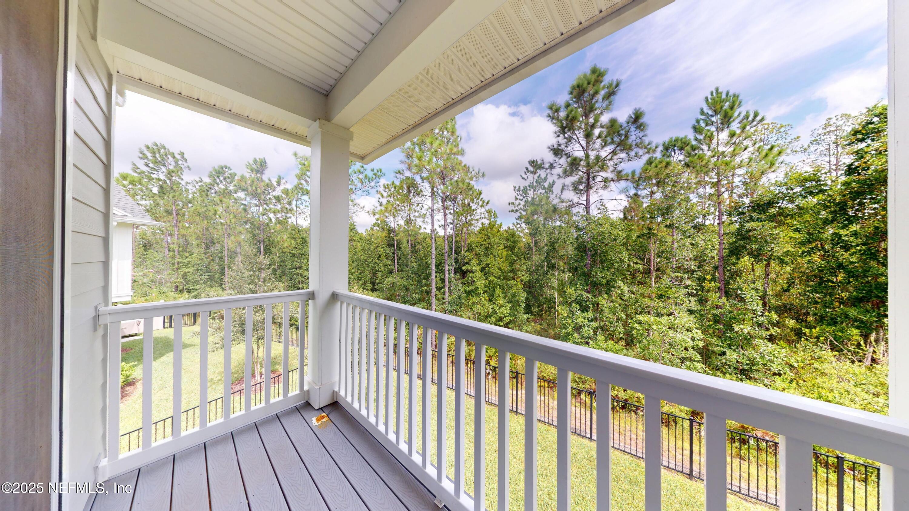 9921 Element Road Jacksonville, FL 32256 - Photo 28 of 37 a view of a balcony with wooden floor