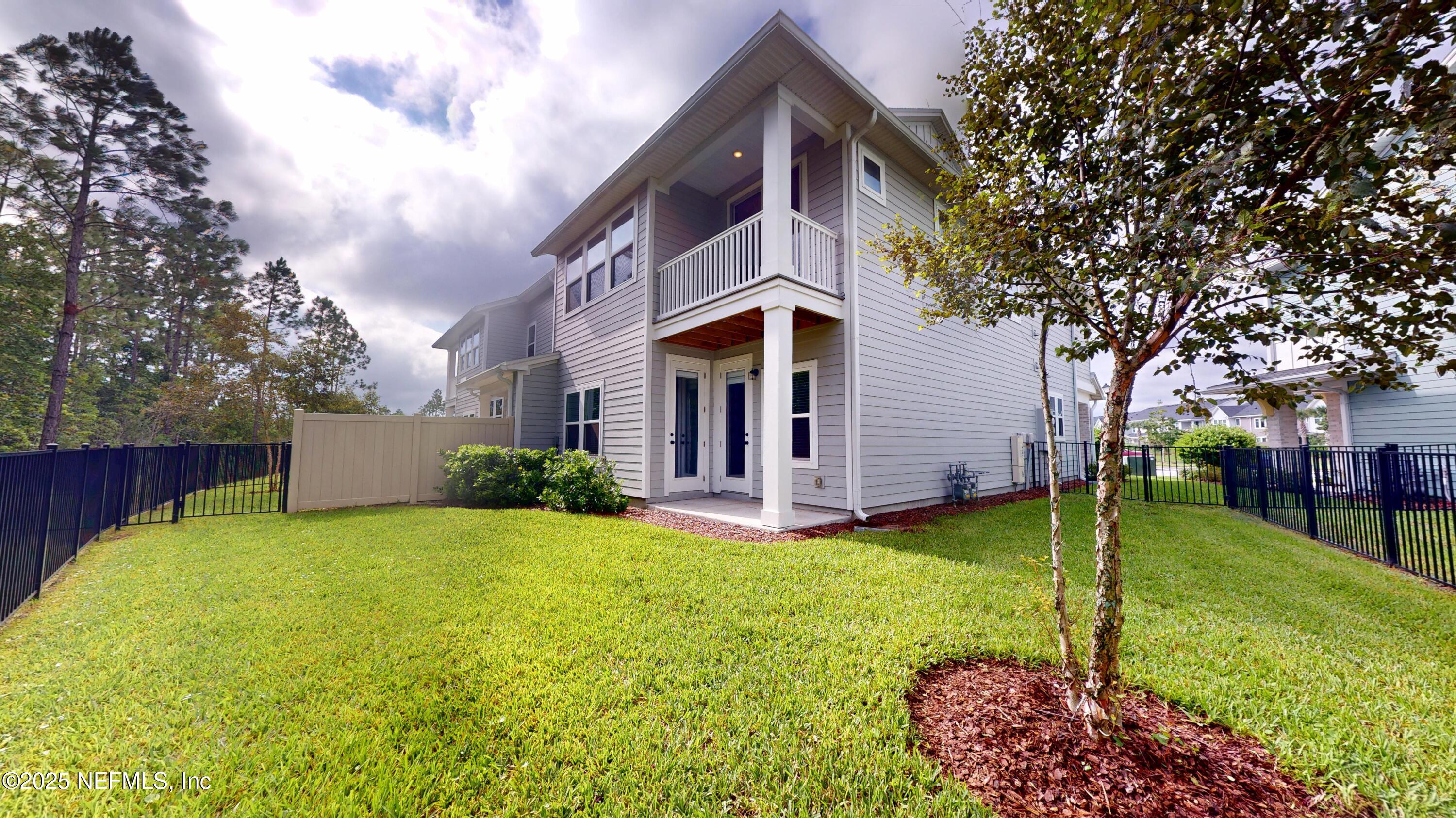 9921 Element Road Jacksonville, FL 32256 - Photo 29 of 37 a view of a house with a yard and plants