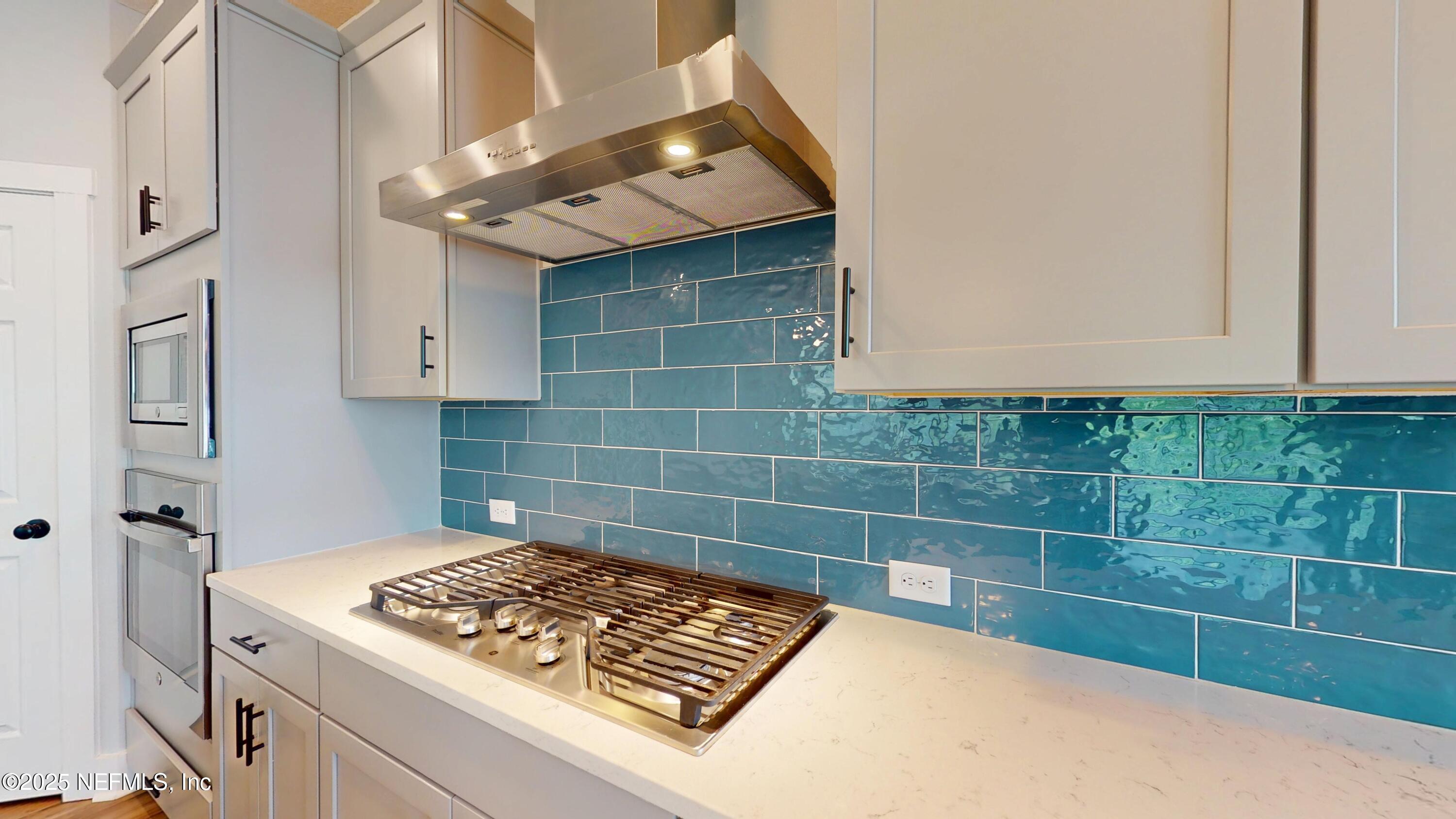 9921 Element Road Jacksonville, FL 32256 - Photo 8 of 37 a bathroom with a sink a toilet and shower