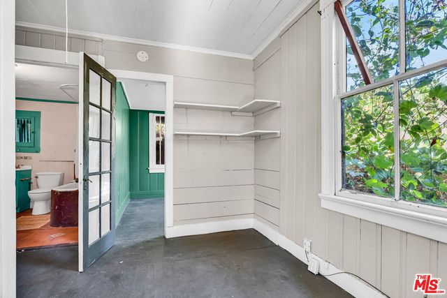a view of a room with table and chairs