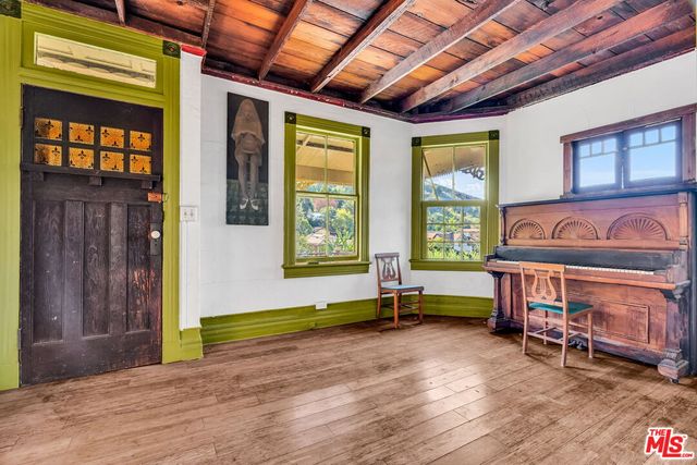 a backyard of a house with barbeque oven table and chairs