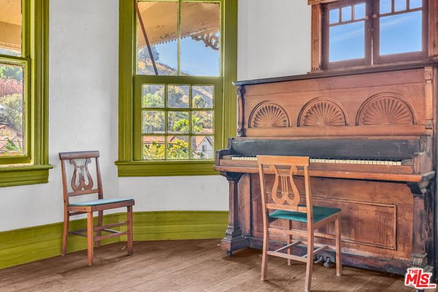 a front view of a house with outdoor seating and a window