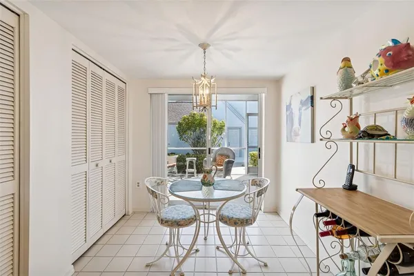 a dining room with furniture and window