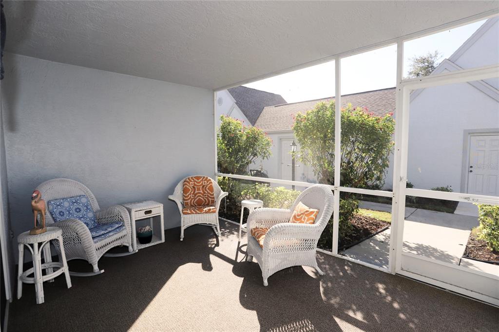 6707 Stone River Road, Unit 101 Bradenton, FL 34203 - Photo 2 of 34 a living room with furniture and a window