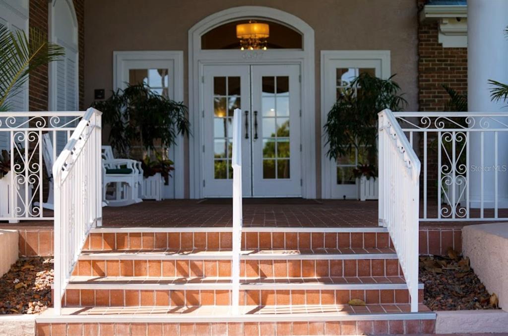 6707 Stone River Road, Unit 101 Bradenton, FL 34203 - Photo 24 of 34 a view of entryway and hall with wooden floor