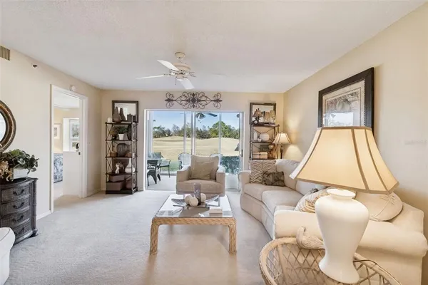 a bedroom with bed and a chandelier