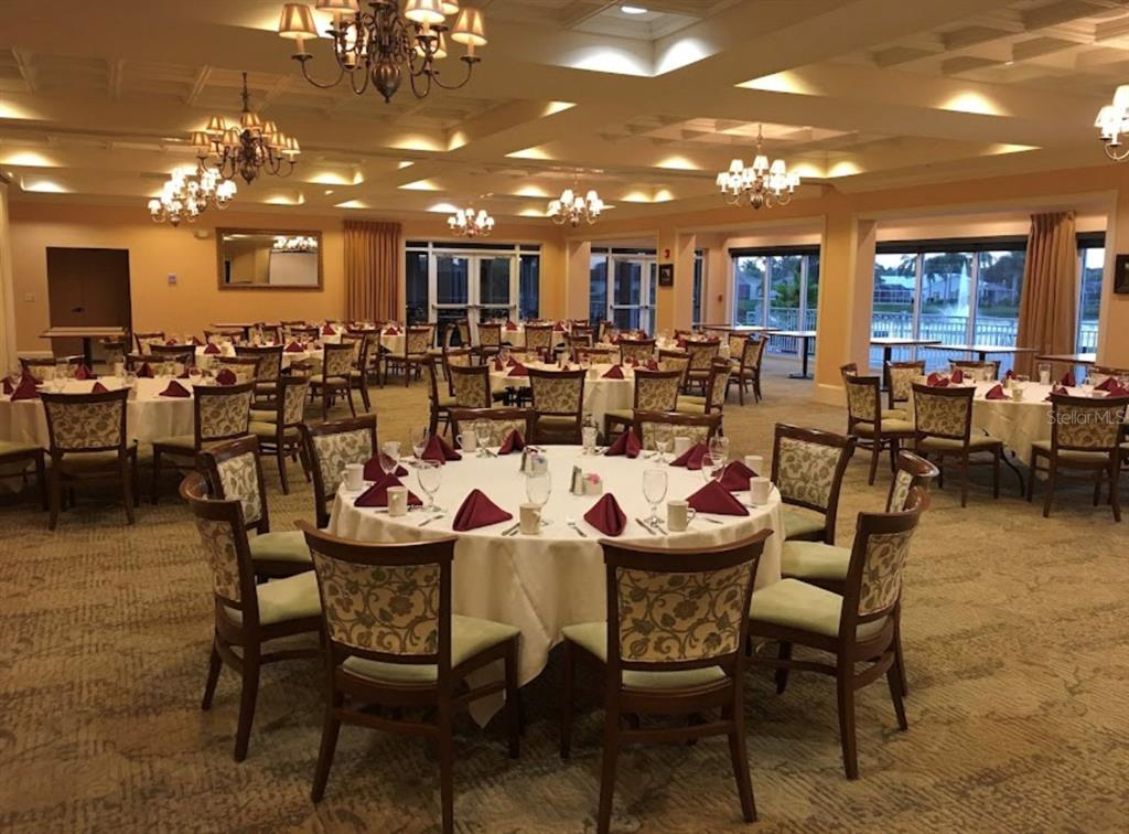 6707 Stone River Road, Unit 101 Bradenton, FL 34203 - Photo 27 of 34 a outdoor dining area with lots of furniture and view of kitchen