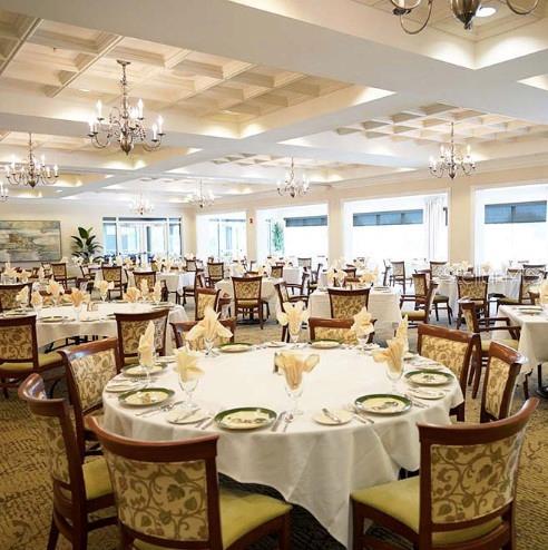 6707 Stone River Road, Unit 101 Bradenton, FL 34203 - Photo 29 of 34 a dining room with lots of furniture and chandelier