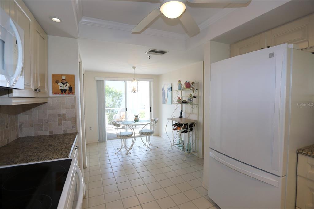 6707 Stone River Road, Unit 101 Bradenton, FL 34203 - Photo 5 of 34 a view of a living room and dining room