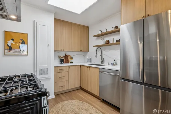 a kitchen with a sink and cabinets