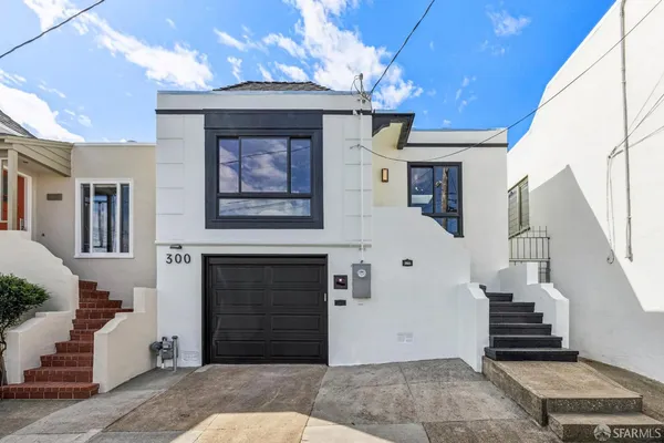 a front view of a house with a garage