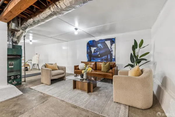 a room with gym equipment and view of living room