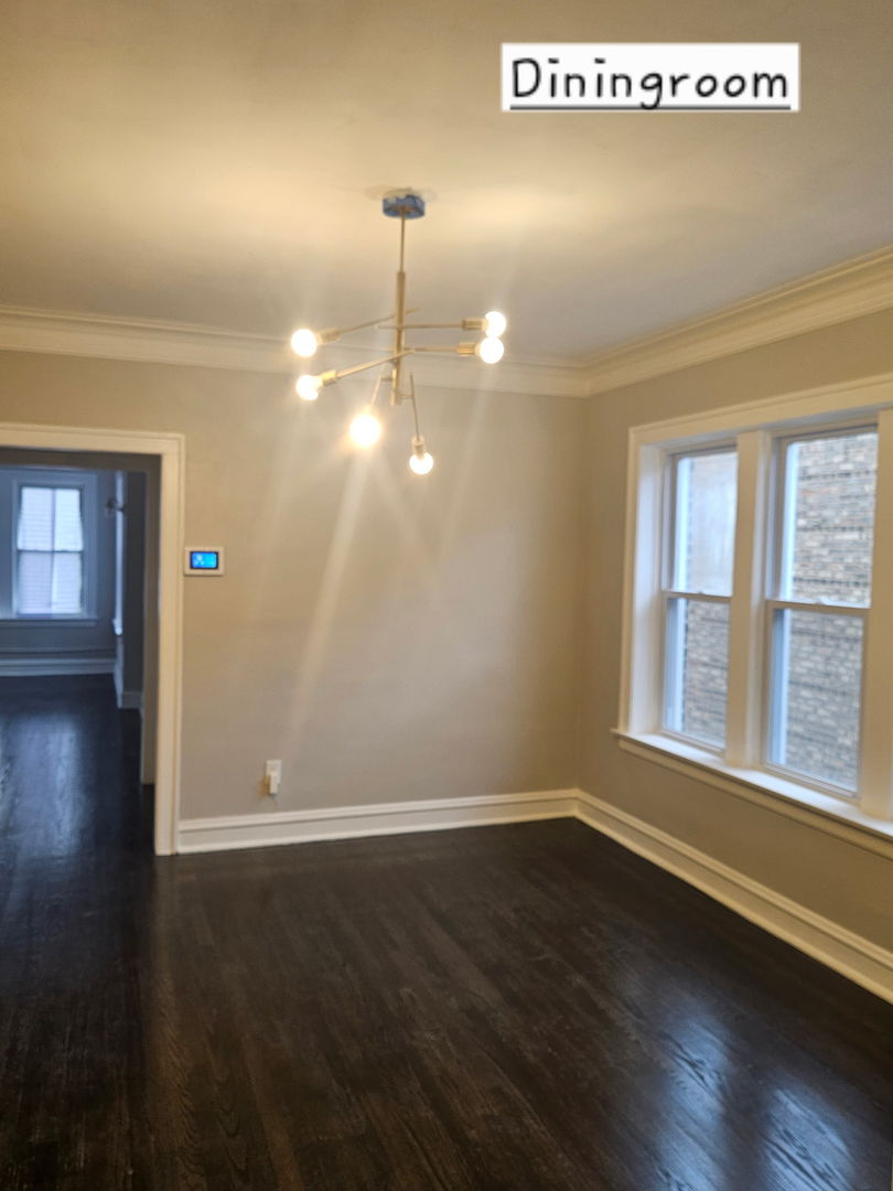 8309 South Throop Street, Unit 3 Chicago, IL 60620 - Photo 7 of 15 a view of a room with wooden floor and window