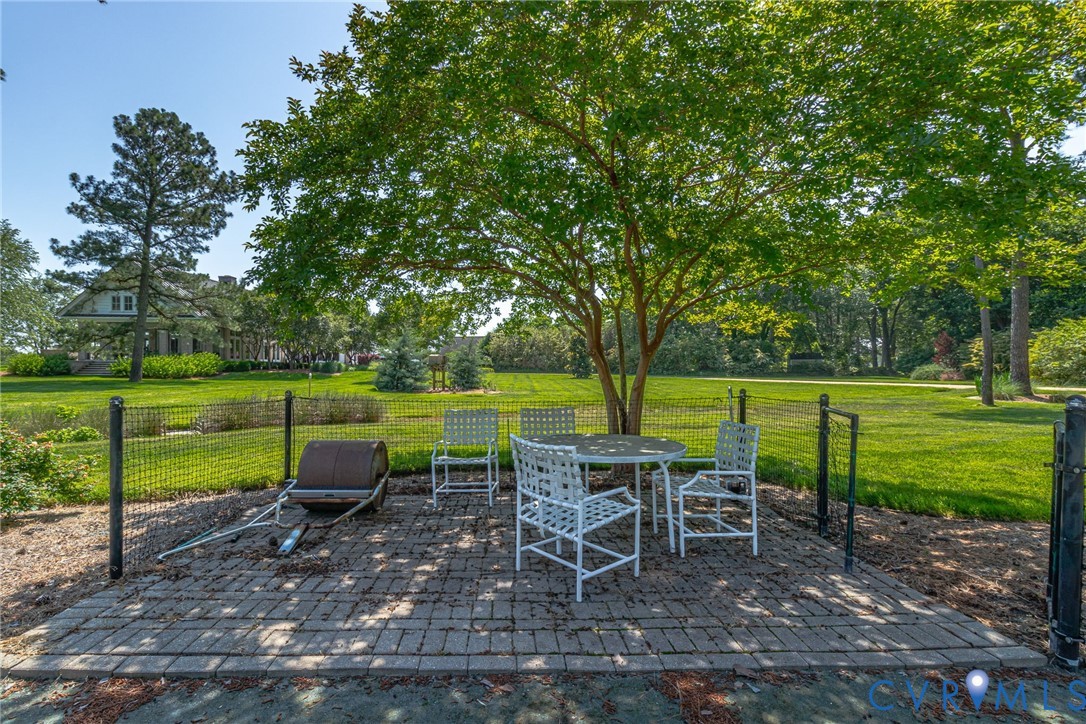 1071 Gum Thicket Road Gwynn, VA 23076 - Photo 13 of 53 a view of a chair and table in the garden