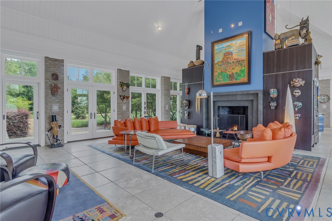 1071 Gum Thicket Road Gwynn, VA 23076 - Photo 17 of 53 a living room with fireplace furniture and a large window